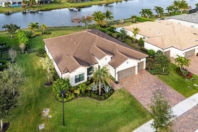 drone / aerial view with a residential view and a water view