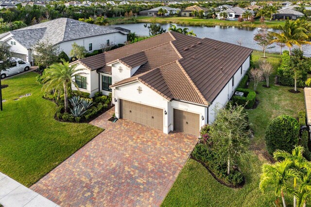 birds eye view of property with a water view