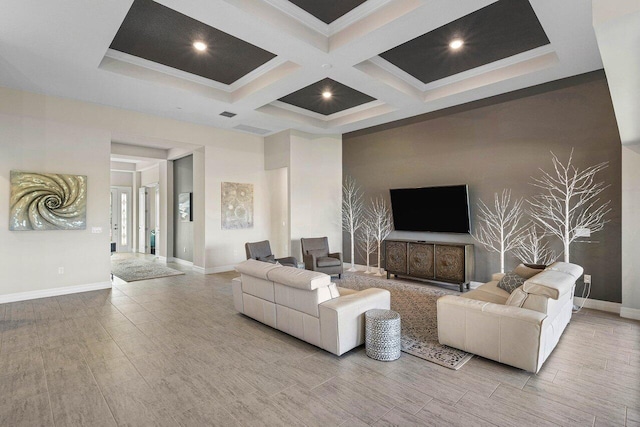 living room with beam ceiling, ornamental molding, and coffered ceiling