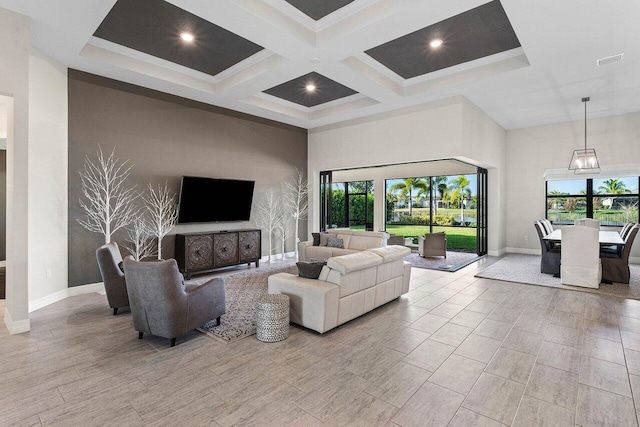 living room featuring ornamental molding, beamed ceiling, and coffered ceiling