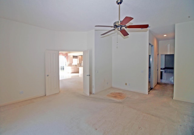 carpeted empty room with ceiling fan