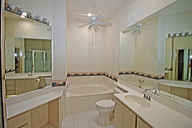 full bathroom with toilet, vanity, ceiling fan, tile patterned floors, and shower with separate bathtub