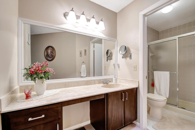 bathroom with toilet, vanity, tile patterned flooring, and a shower with door