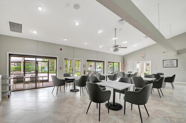 dining room with a wealth of natural light, beam ceiling, and french doors