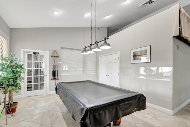 game room with billiards, vaulted ceiling, and light tile patterned floors