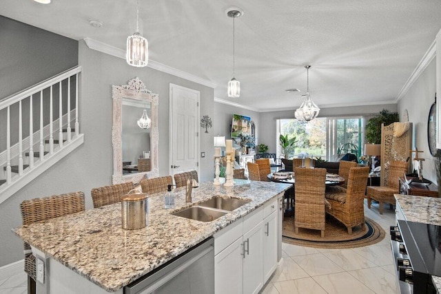 kitchen featuring white cabinetry, a center island with sink, dishwasher, pendant lighting, and sink