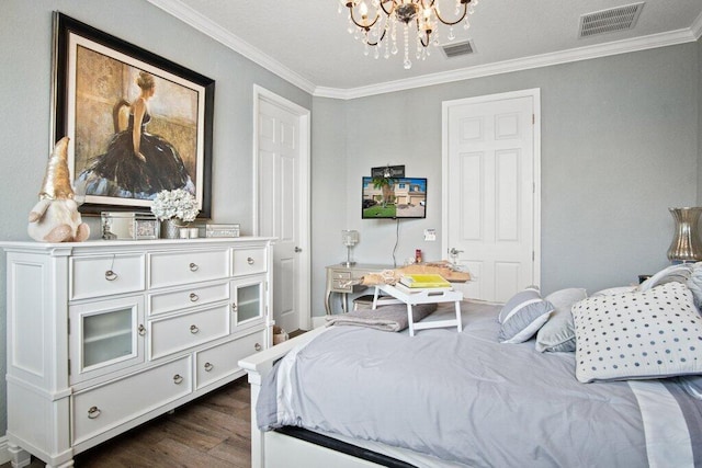 bedroom featuring dark hardwood / wood-style flooring, crown molding, and a chandelier