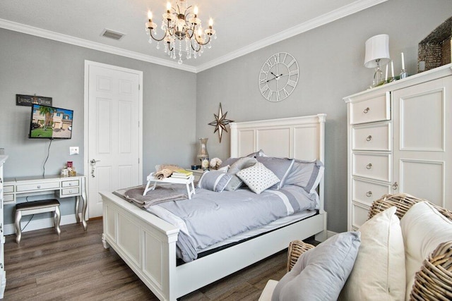 bedroom featuring dark wood-type flooring, ornamental molding, and a notable chandelier