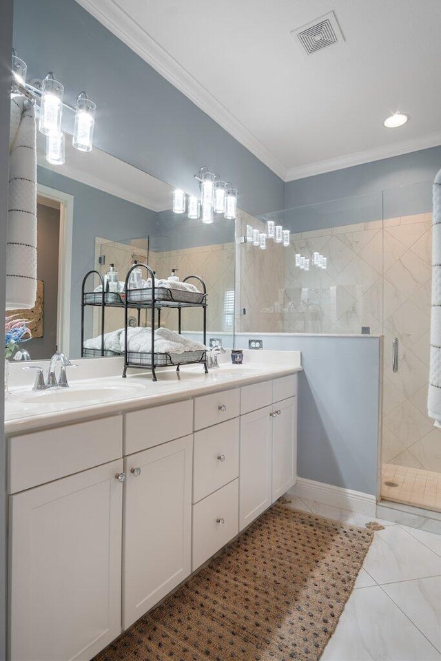 bathroom with a shower with shower door, vanity, tile patterned flooring, and ornamental molding