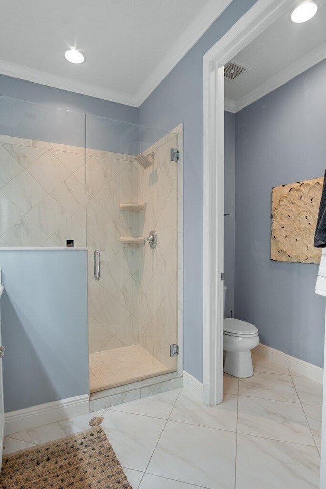 bathroom with toilet, a shower with door, and ornamental molding