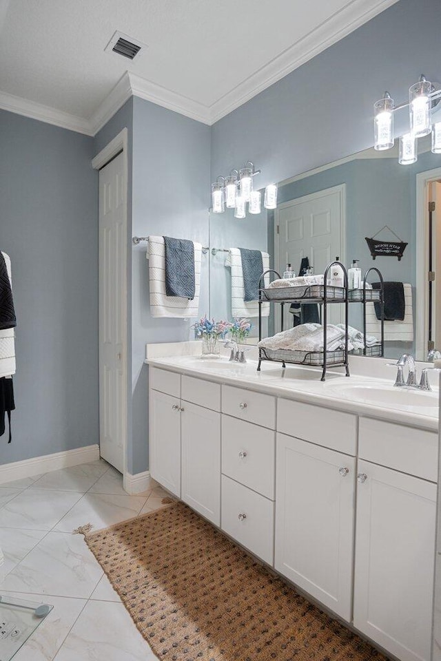 bathroom with vanity and ornamental molding