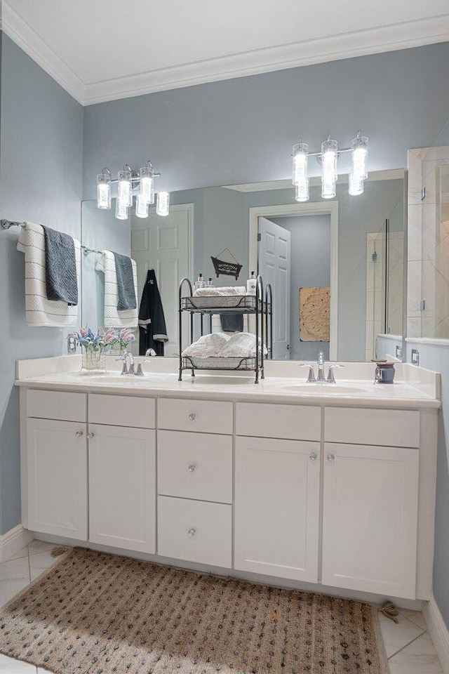 bathroom with a shower with door, vanity, and ornamental molding