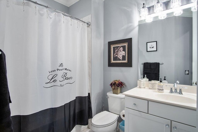 bathroom with toilet and vanity