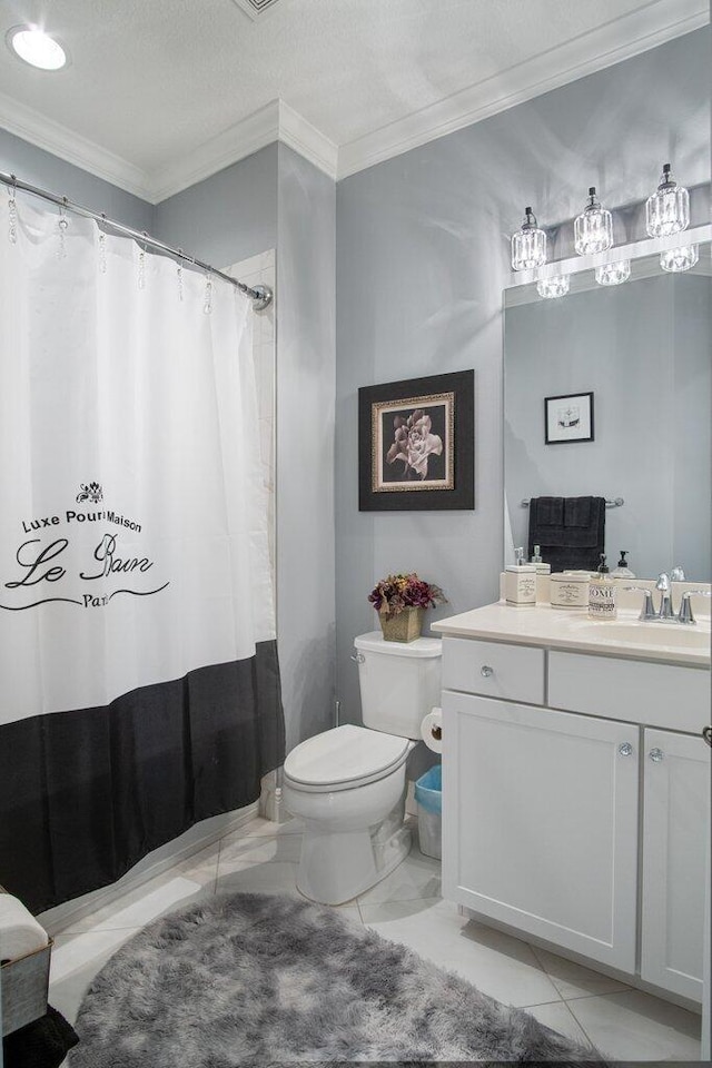 bathroom with a textured ceiling, toilet, vanity, and crown molding