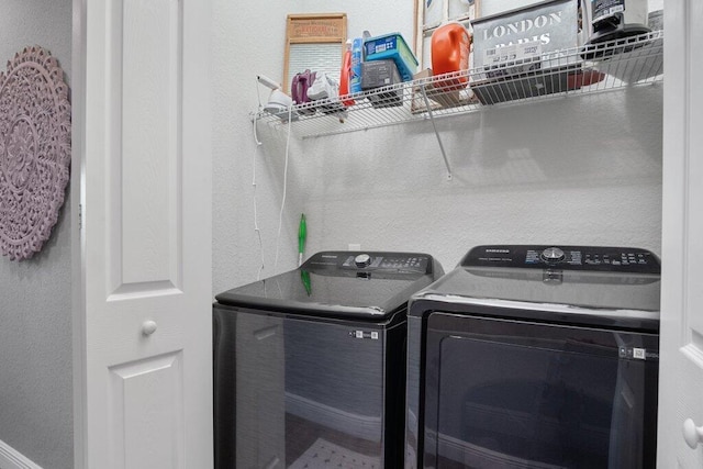 laundry area with independent washer and dryer