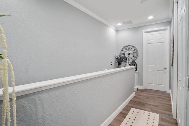 hall featuring dark wood-type flooring and ornamental molding