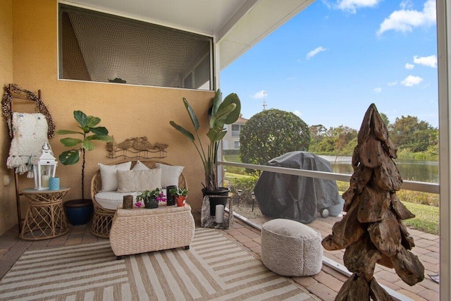 deck featuring grilling area and a water view