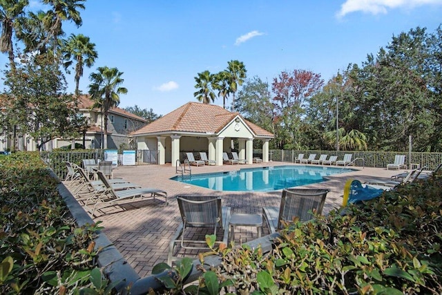 view of swimming pool with a patio