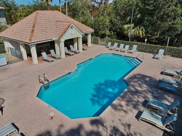 view of swimming pool featuring a patio area