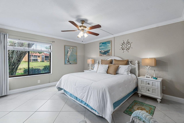 bedroom featuring ceiling fan, light tile patterned floors, and ornamental molding