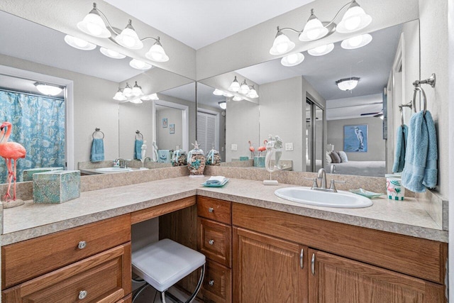 bathroom with ceiling fan and vanity