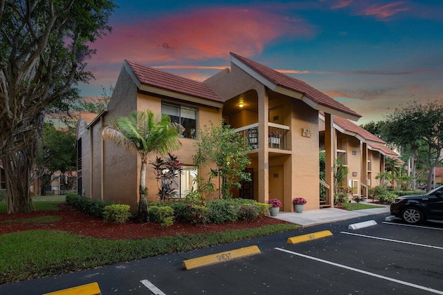 view of outdoor building at dusk