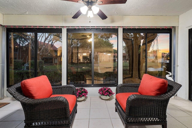 patio terrace at dusk featuring ceiling fan