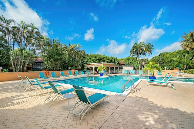 view of swimming pool with a patio area