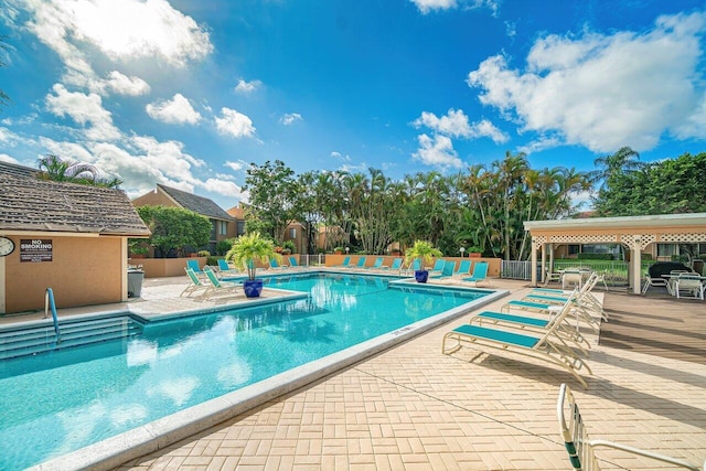 view of swimming pool featuring a patio area