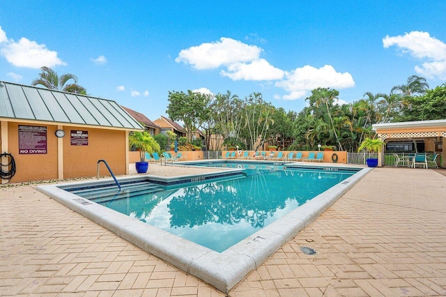 view of swimming pool featuring a patio area