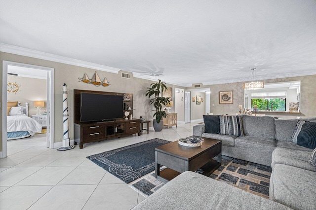 tiled living room with crown molding and an inviting chandelier