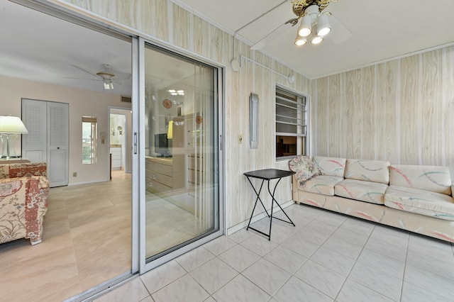 tiled living room featuring ceiling fan