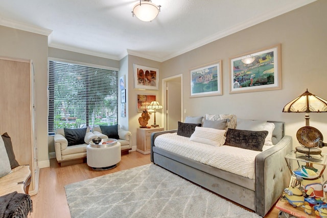 living room featuring hardwood / wood-style flooring and ornamental molding