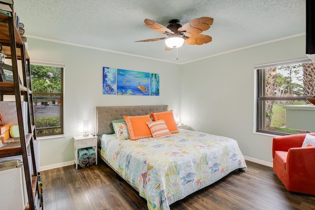 bedroom with ornamental molding, dark wood-type flooring, a textured ceiling, and ceiling fan