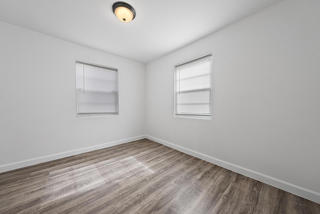 spare room with hardwood / wood-style floors