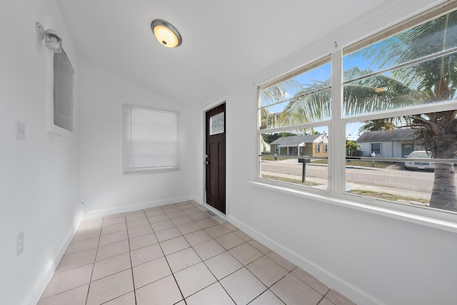 interior space with a healthy amount of sunlight and vaulted ceiling