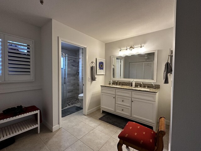 tiled bedroom featuring ceiling fan and a textured ceiling