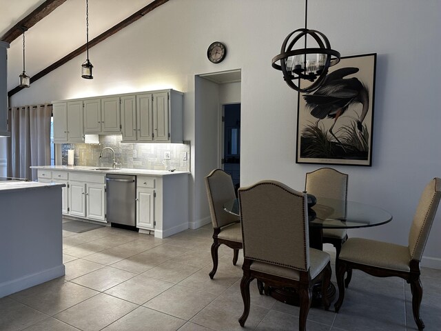 tiled living room with ceiling fan with notable chandelier and lofted ceiling with beams