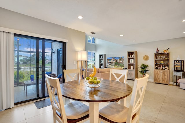 tiled dining room with plenty of natural light