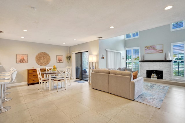 living room with light tile patterned floors and a wealth of natural light