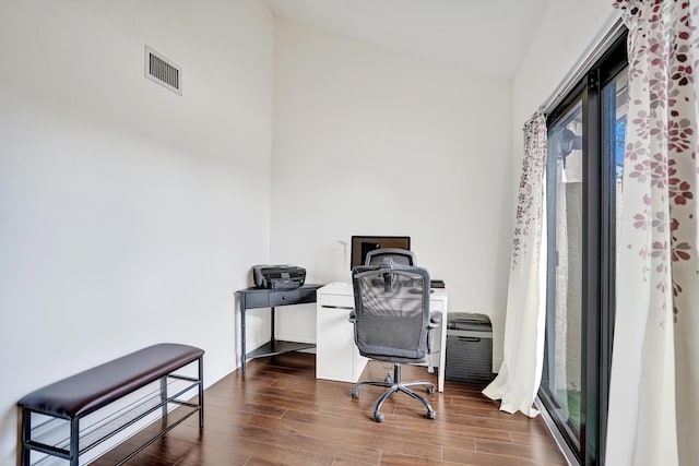 home office with dark hardwood / wood-style floors