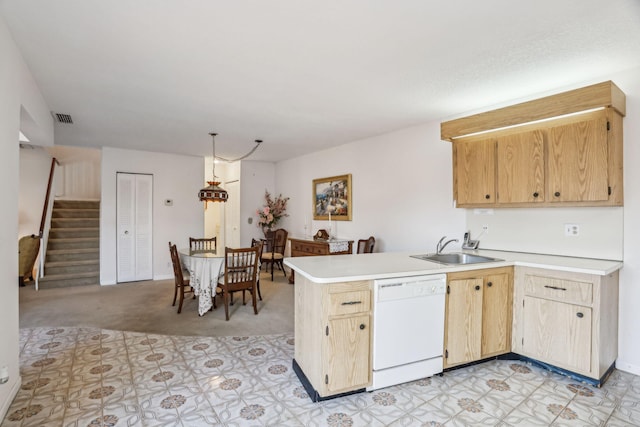 kitchen featuring light brown cabinets, sink, kitchen peninsula, white dishwasher, and light colored carpet