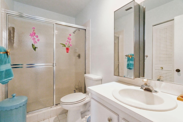 bathroom with toilet, tile patterned flooring, an enclosed shower, and vanity