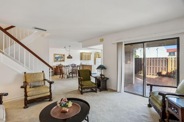 living room featuring light carpet