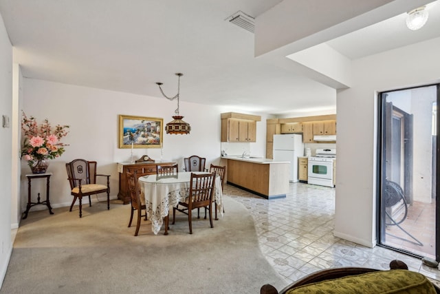 dining space featuring sink