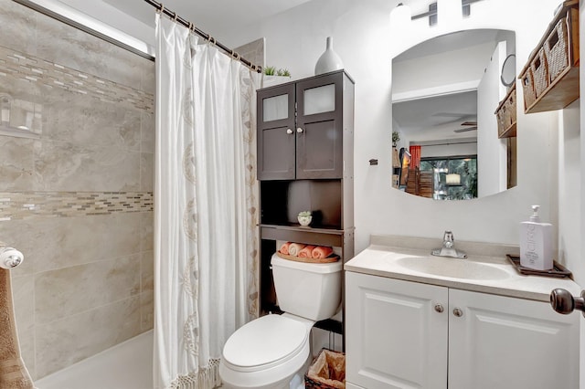 bathroom with vanity, toilet, and a shower with shower curtain