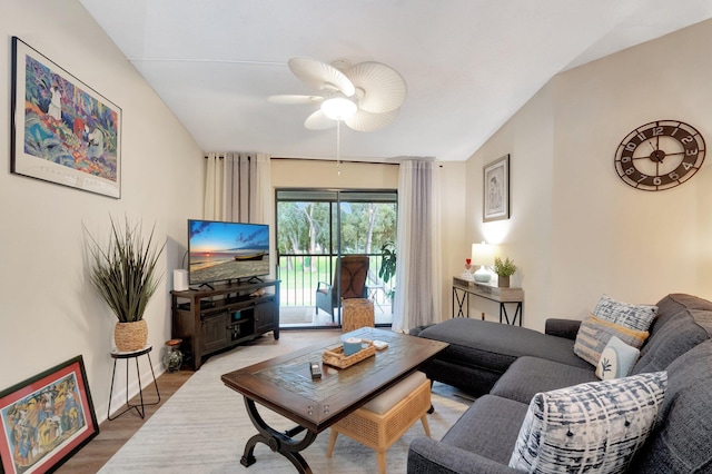 living room with wood-type flooring and ceiling fan