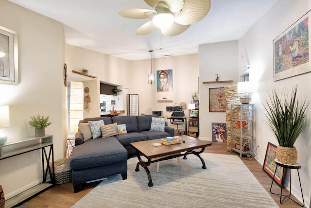 living room with hardwood / wood-style flooring and ceiling fan