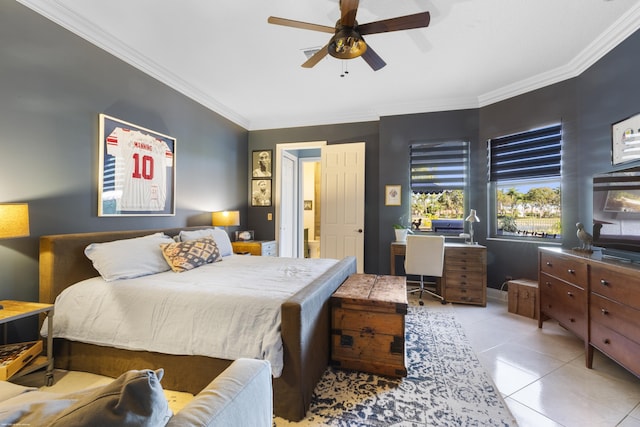 tiled bedroom with ceiling fan and ornamental molding