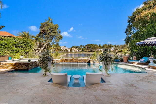 view of pool featuring pool water feature, a patio area, and an in ground hot tub